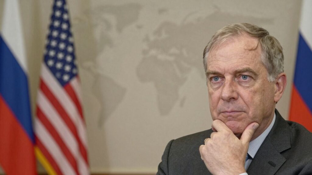 US and Russian flags with Dr. Gilbert Doctorow.