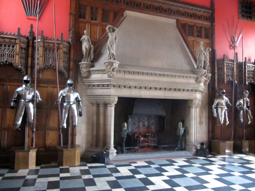Suits of armour and the carved fireplace in the Great Hall at Edinburgh Castle