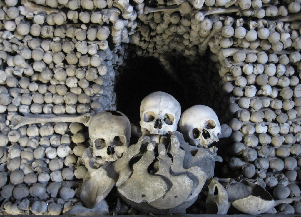 Skulls and bones stacked inside the Sedlec Ossuary in Kutná Hora