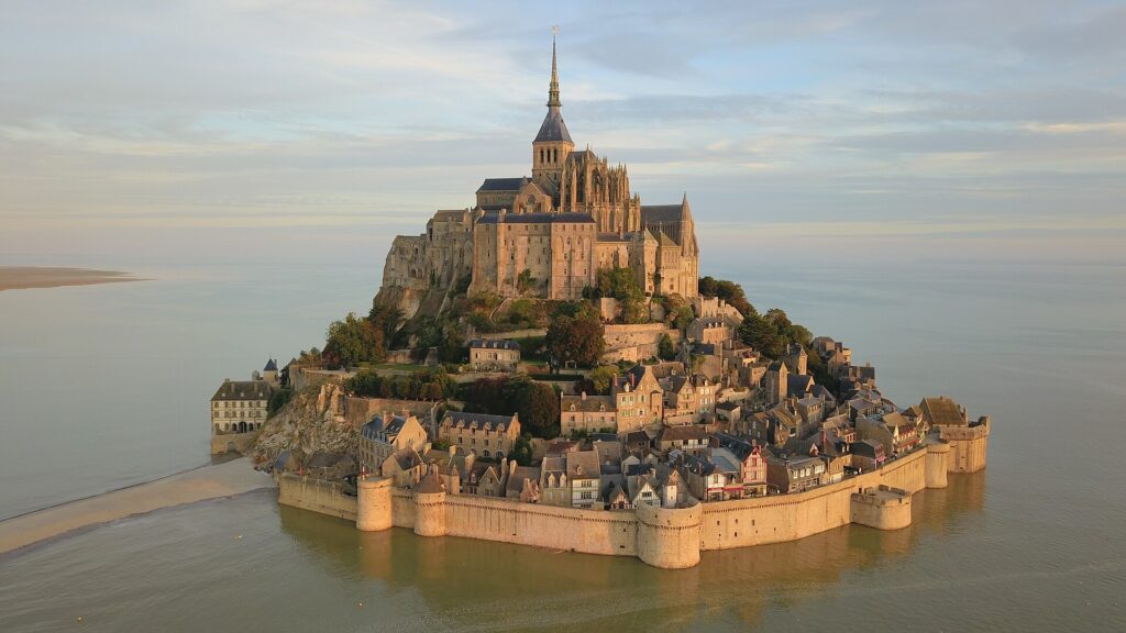 Aerial view of Mont-Saint-Michel surrounded by water at high tide