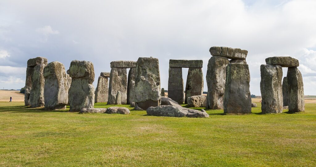 The Stonehenge stone circle on Salisbury Plain under a pale sky