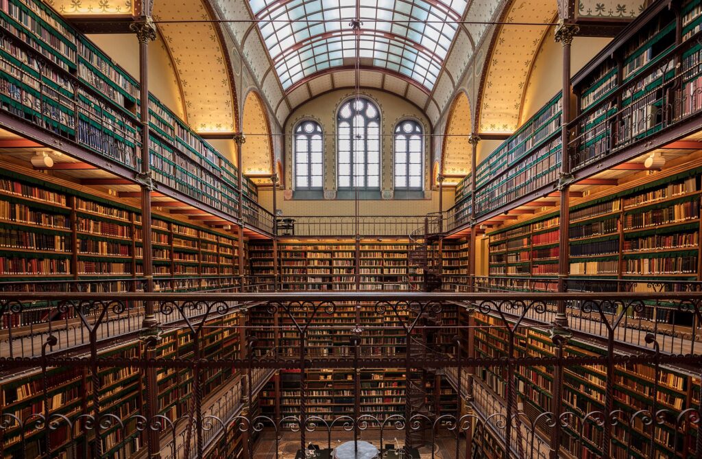 The Cuypers Library inside the Rijksmuseum with iron galleries and a glass roof