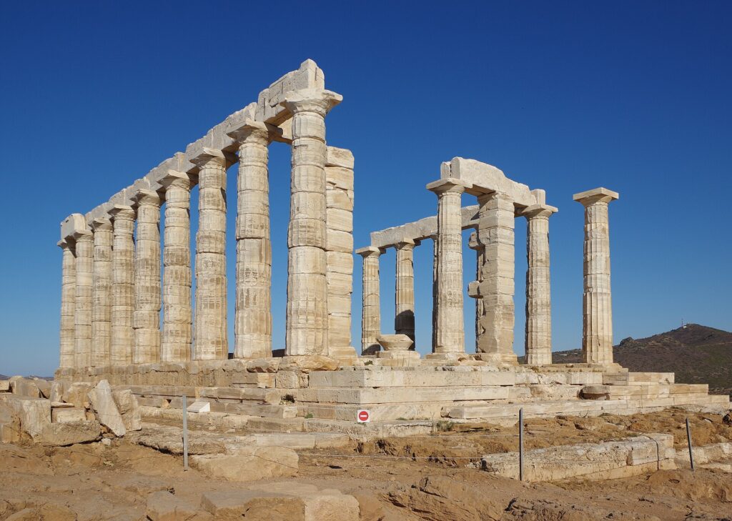 The Temple of Poseidon at Cape Sounion under a blue sky