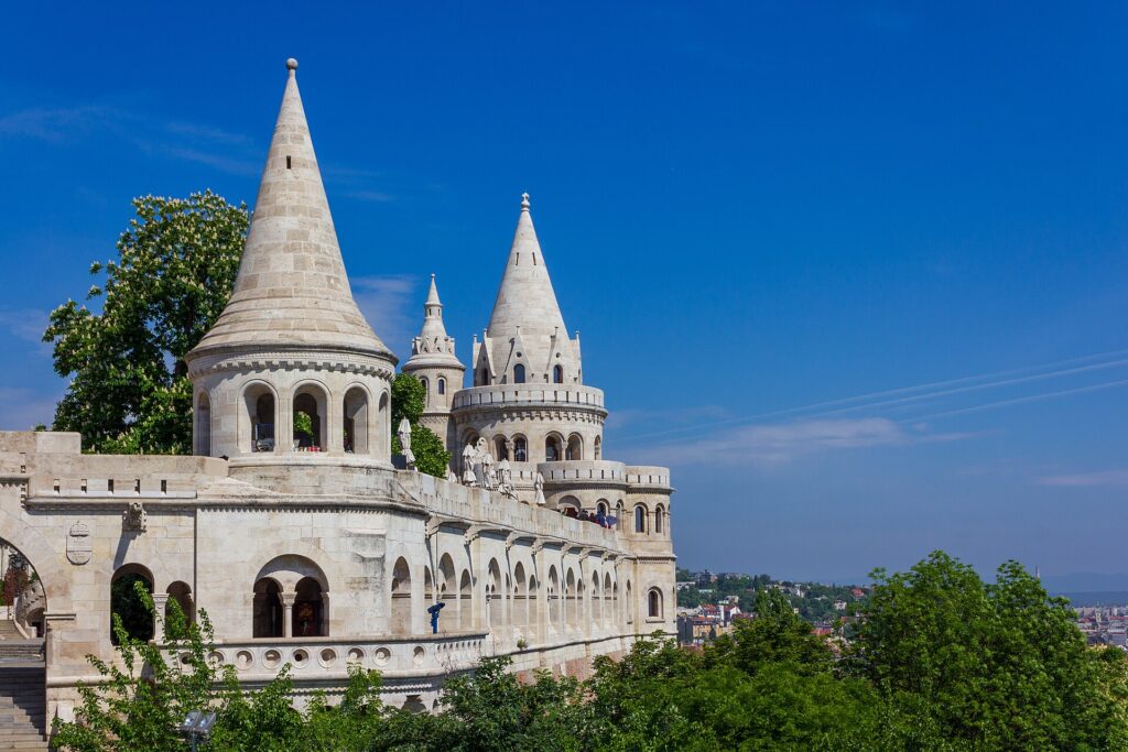 White turrets of Fisherman's Bastion in Budapest against a blue sky