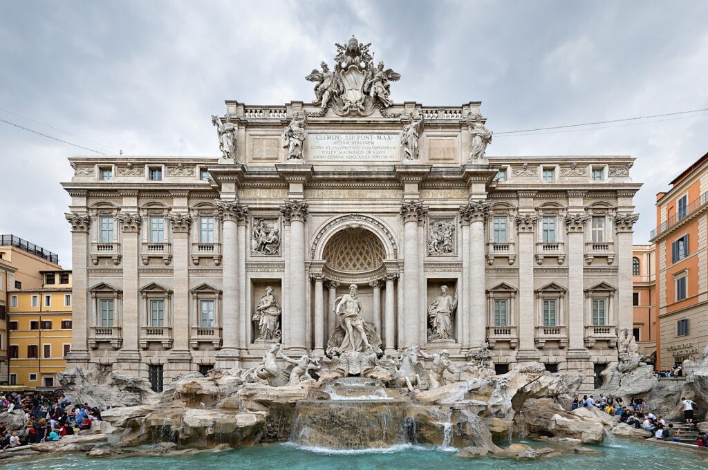 The Trevi Fountain in Rome with its Baroque palace façade and turquoise basin