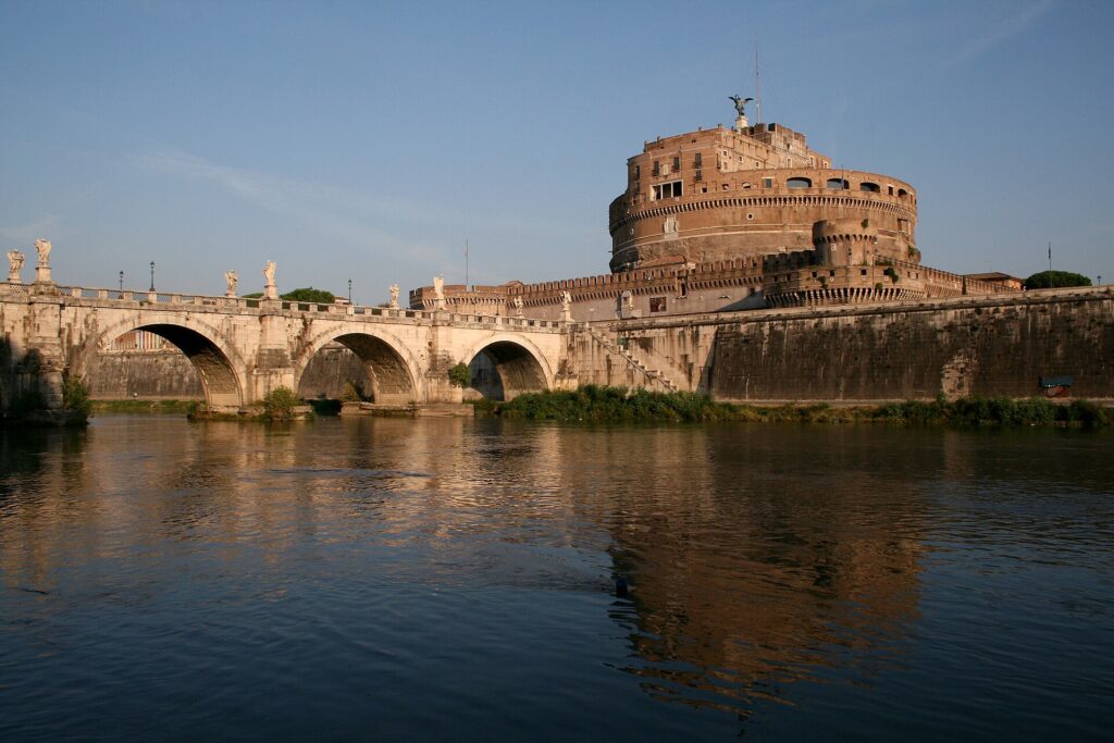 Castel Sant'Angelo and Ponte Sant'Angelo reflected in the Tiber in Rome