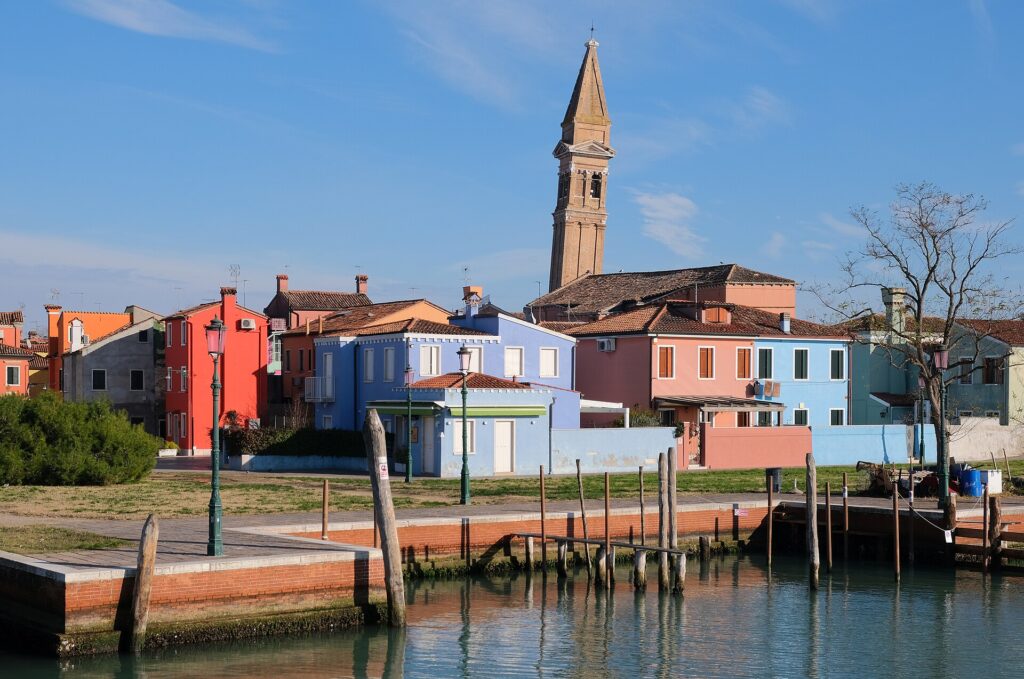 Colourful houses and the leaning bell tower on the island of Burano in the Venetian lagoon